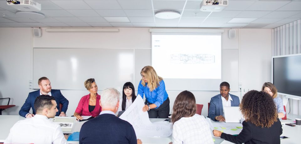 Team of architects and project managers meeting in office